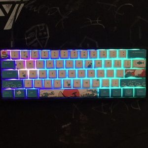 Ducky one 2 mini it has brown key switch’s and it has costume key caps